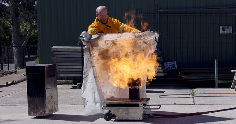 Global Wind Organisation (GWO) course student Sam with fire blanket
